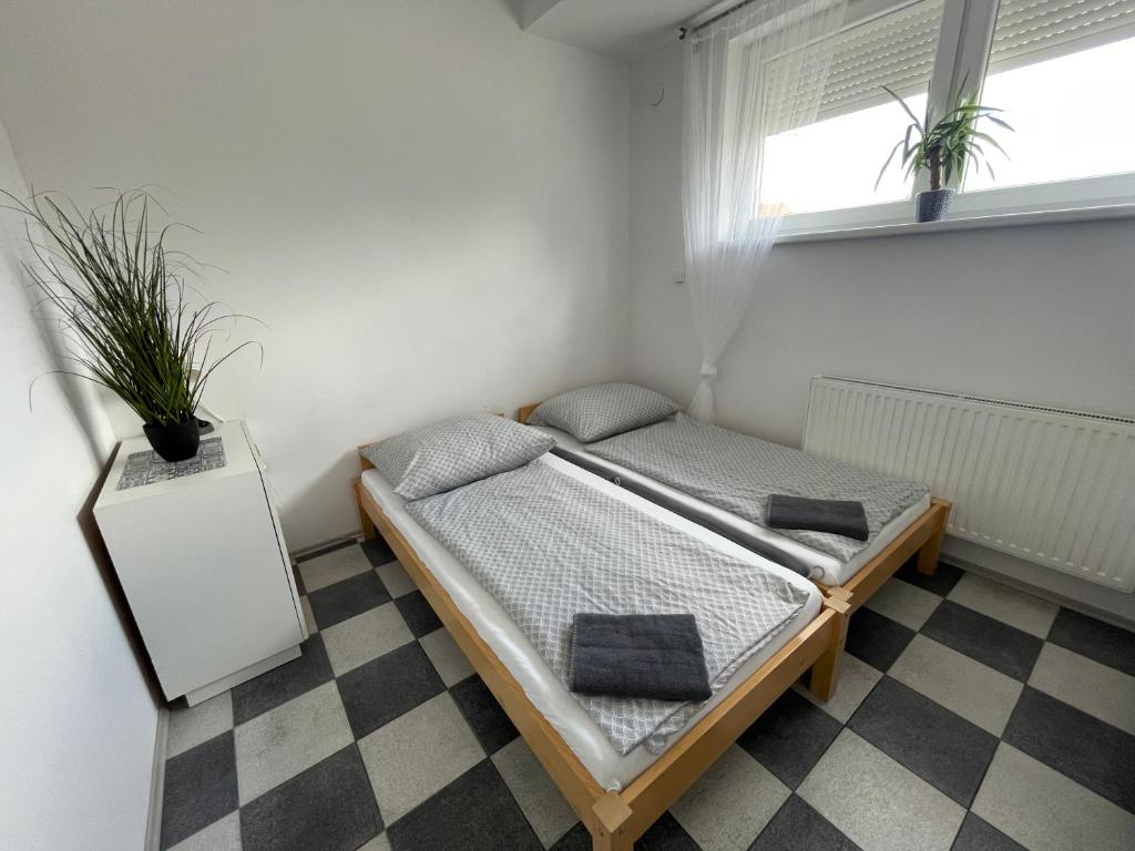 Postel nebo postele na pokoji v ubytování Apartmány Bella Moravia