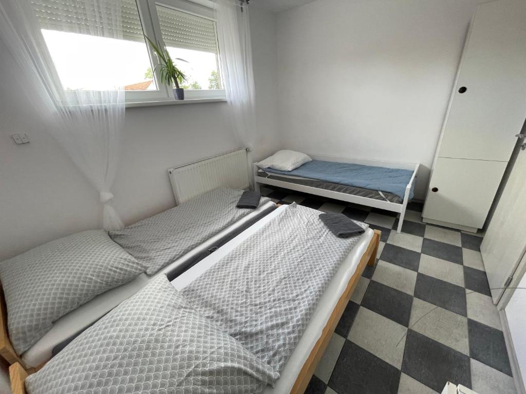 Postel nebo postele na pokoji v ubytování Apartmány Bella Moravia