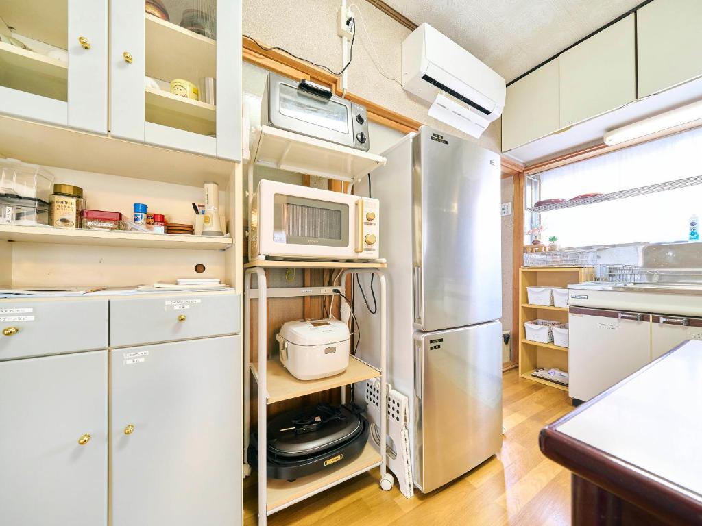 Kuchyň nebo kuchyňský kout v ubytování Kokoyui Guest House