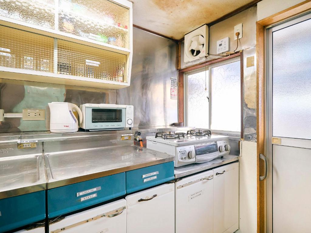 Kuchyň nebo kuchyňský kout v ubytování Kokoyui Guest House