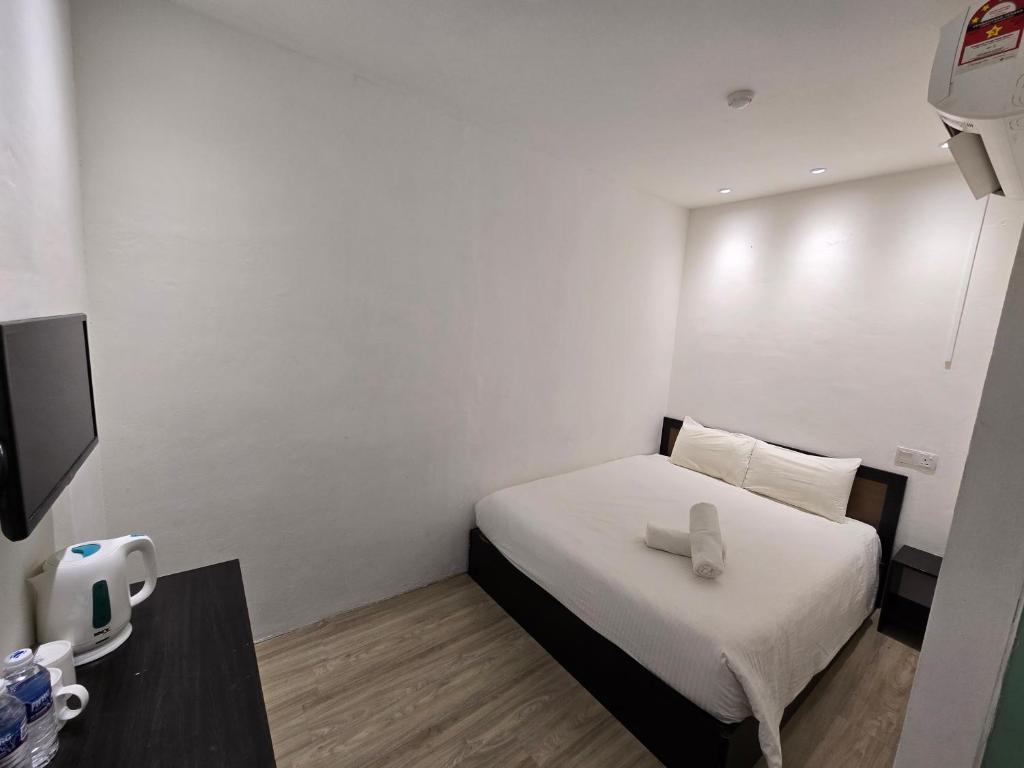 Postel nebo postele na pokoji v ubytování One Point Inn King Centre