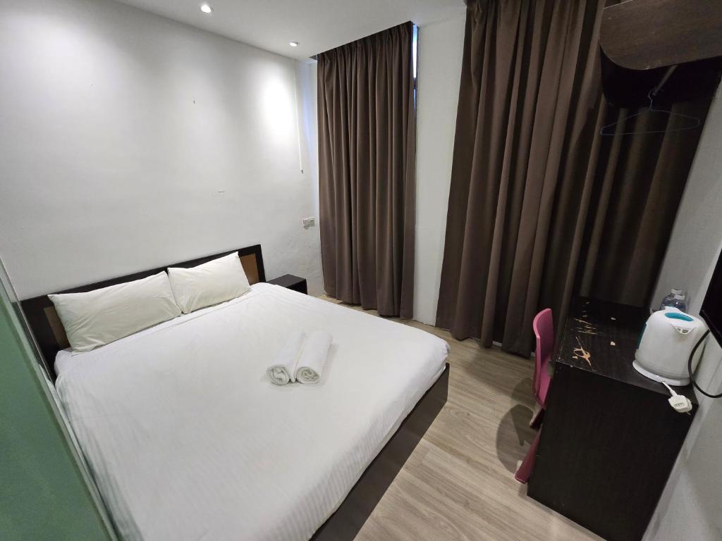 Postel nebo postele na pokoji v ubytování One Point Inn King Centre