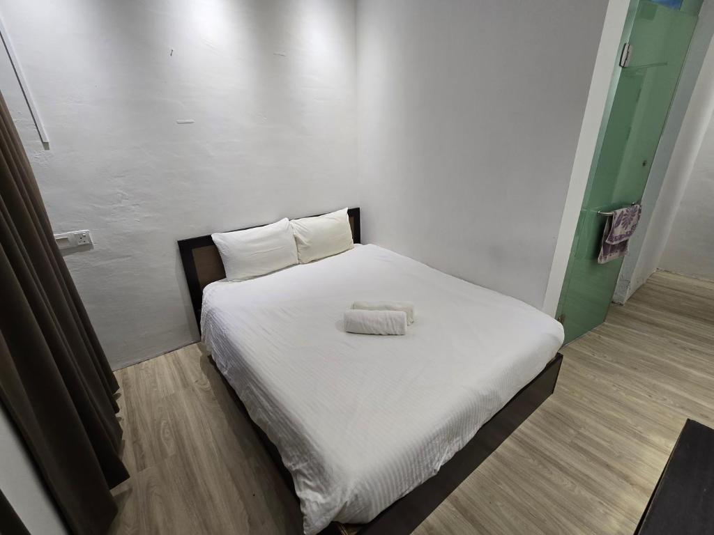 Postel nebo postele na pokoji v ubytování One Point Inn King Centre