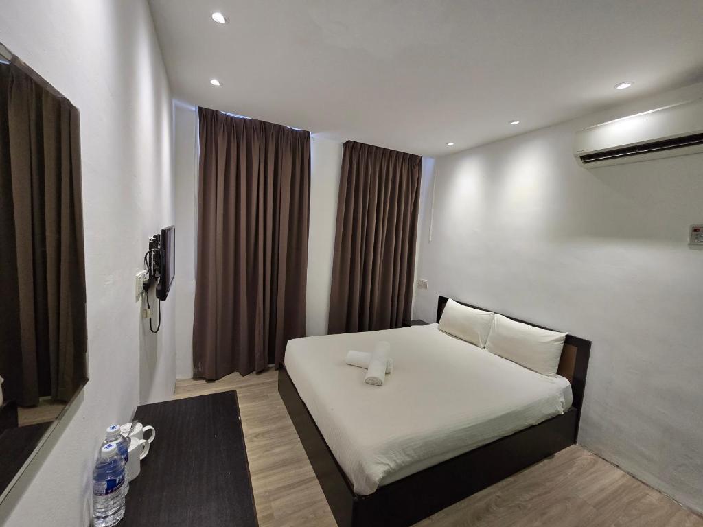 Postel nebo postele na pokoji v ubytování One Point Inn King Centre
