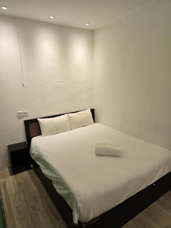 Postel nebo postele na pokoji v ubytování One Point Inn King Centre