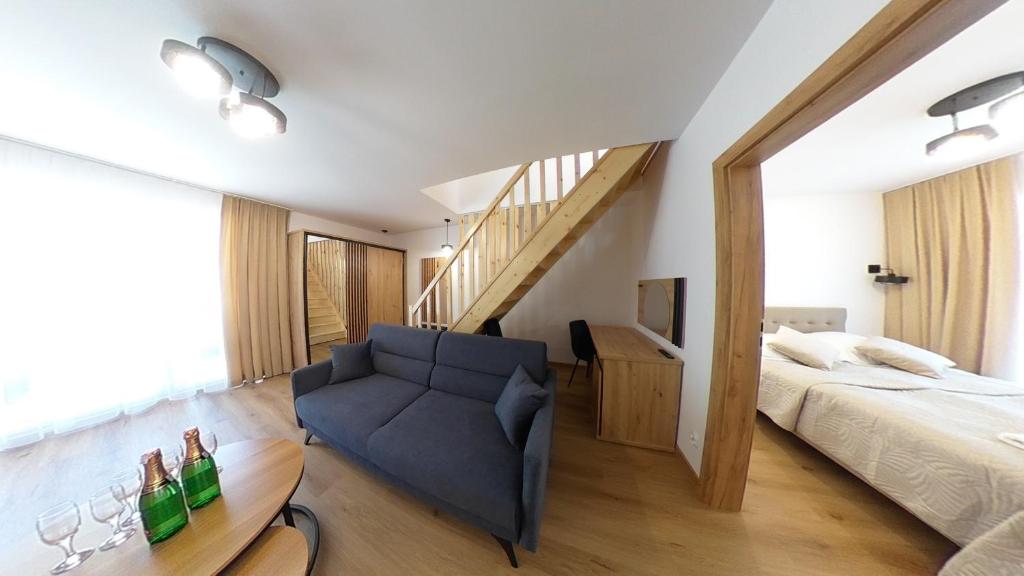 Łóżko lub łóżka w pokoju w obiekcie Apartament ARKA