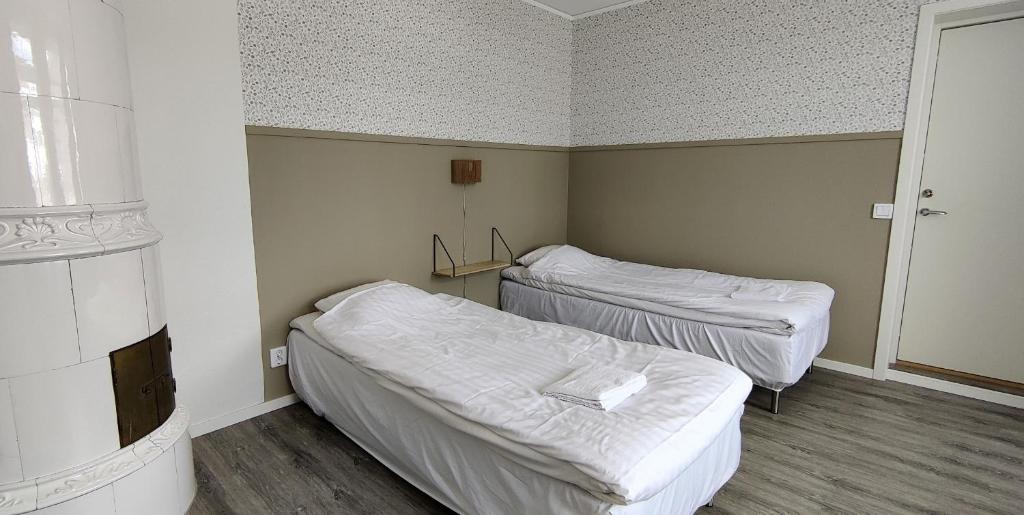 Postel nebo postele na pokoji v ubytování Lilla Hotellet i Nybro