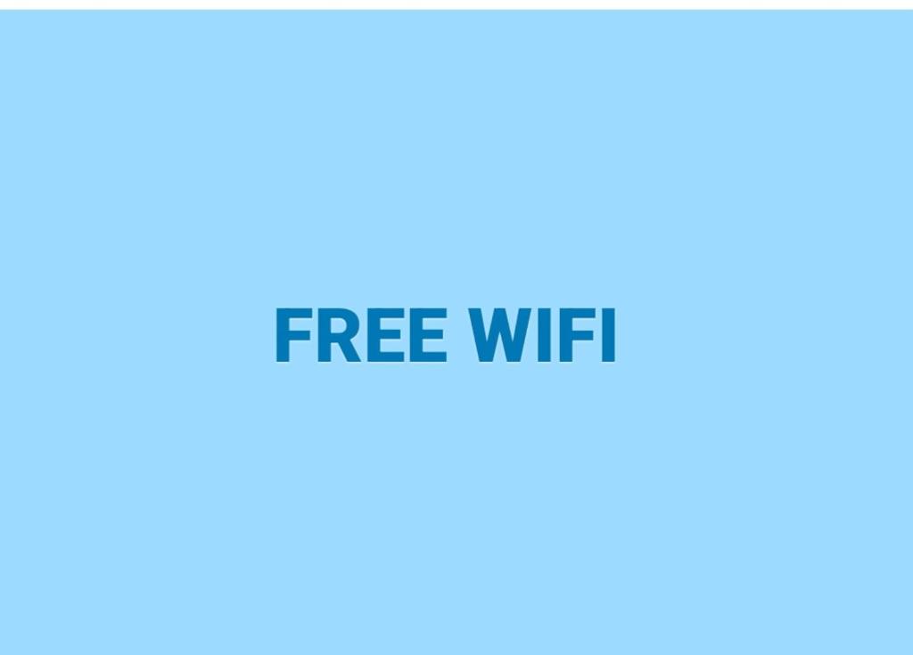 a blue sign with the words free wifi at Lake District 2021 Deluxe Static Caravan on Haven Lakeland in Flookburgh