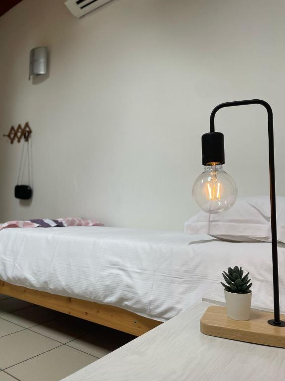 Postel nebo postele na pokoji v ubytování Ostello Casa Rossa