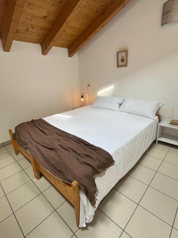 Postel nebo postele na pokoji v ubytování Ostello Casa Rossa