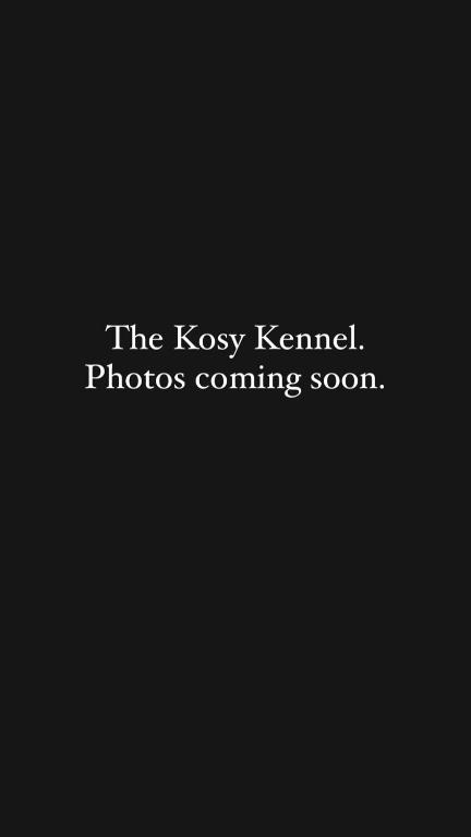 a sign that says the koxy kennel photos coming soon at The Kosy Kennel in Helvetia