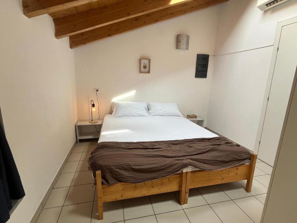 Postel nebo postele na pokoji v ubytování Ostello Casa Rossa