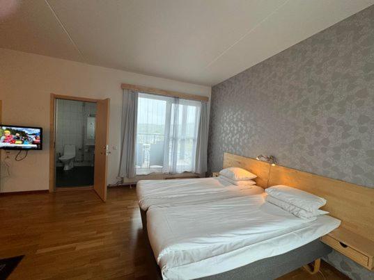 Postel nebo postele na pokoji v ubytování Hotell Årjäng