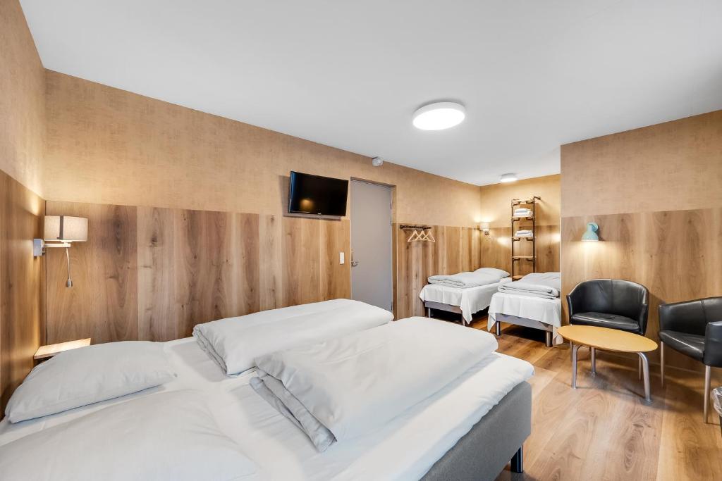 Postel nebo postele na pokoji v ubytování Hvide Sande Hotel
