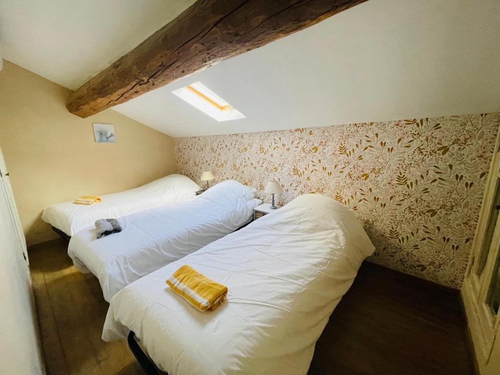 Postel nebo postele na pokoji v ubytování La Bastide des Songes - Demeure d'hôtes