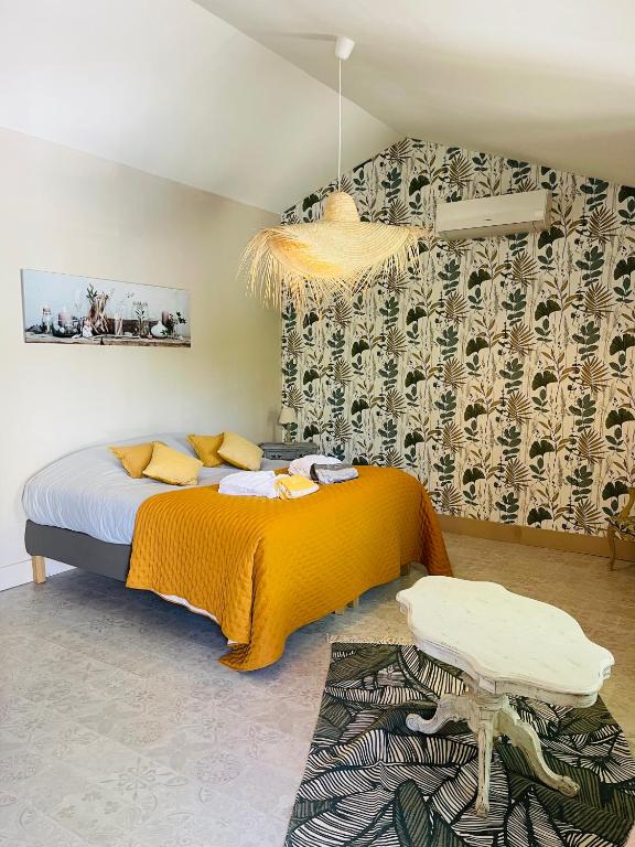 Postel nebo postele na pokoji v ubytování La Bastide des Songes - Demeure d'hôtes