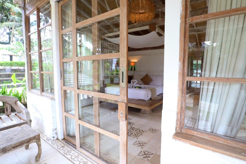 Postel nebo postele na pokoji v ubytování Aventus Resort Ubud