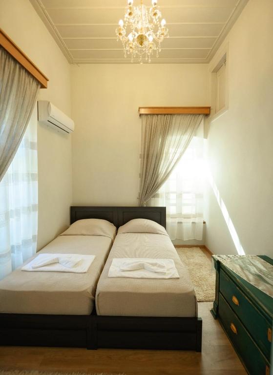 Postel nebo postele na pokoji v ubytování STEMA Kalymnos