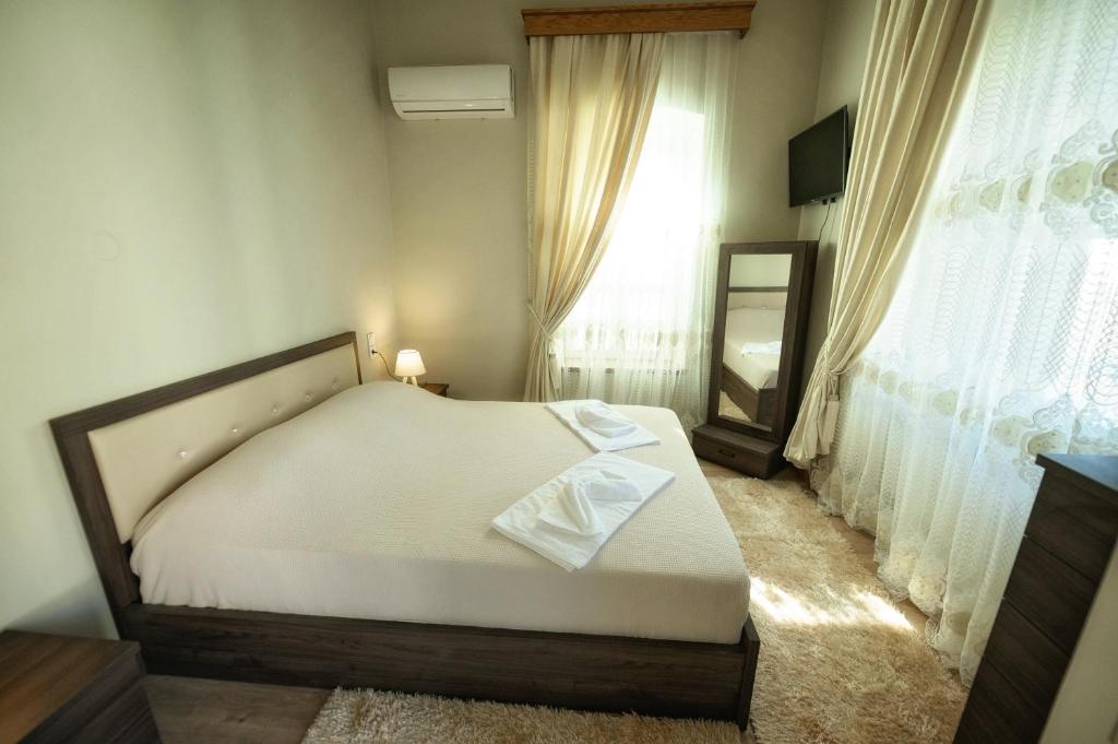Postel nebo postele na pokoji v ubytování STEMA Kalymnos