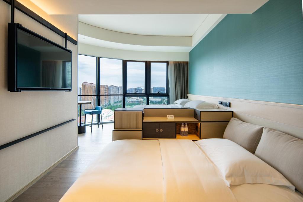 Postel nebo postele na pokoji v ubytování Artyzen Habitat Hengqin Zhuhai