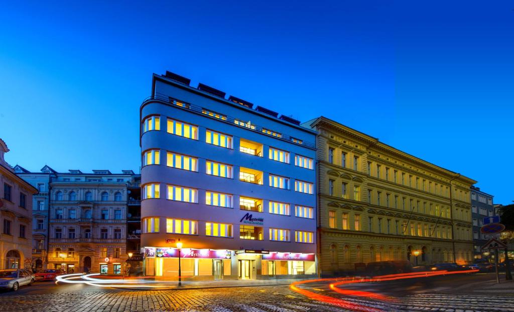 a building on a city street at night at Myo Hotel Mysterius in Prague