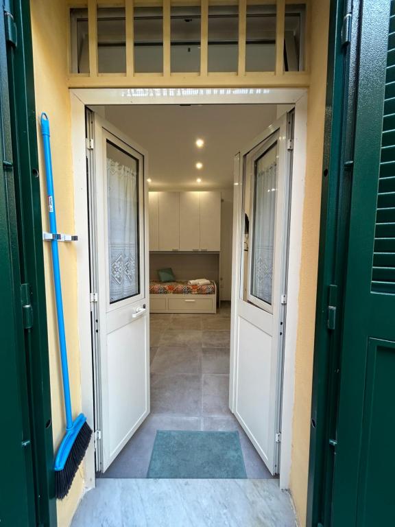 an open door into a room with a bedroom at Sermoneta10 in Naples