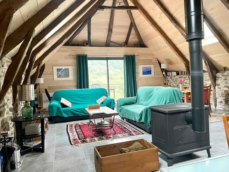 Posezení v ubytování Gîte Le Couderc de Coubisou, grange rénovée