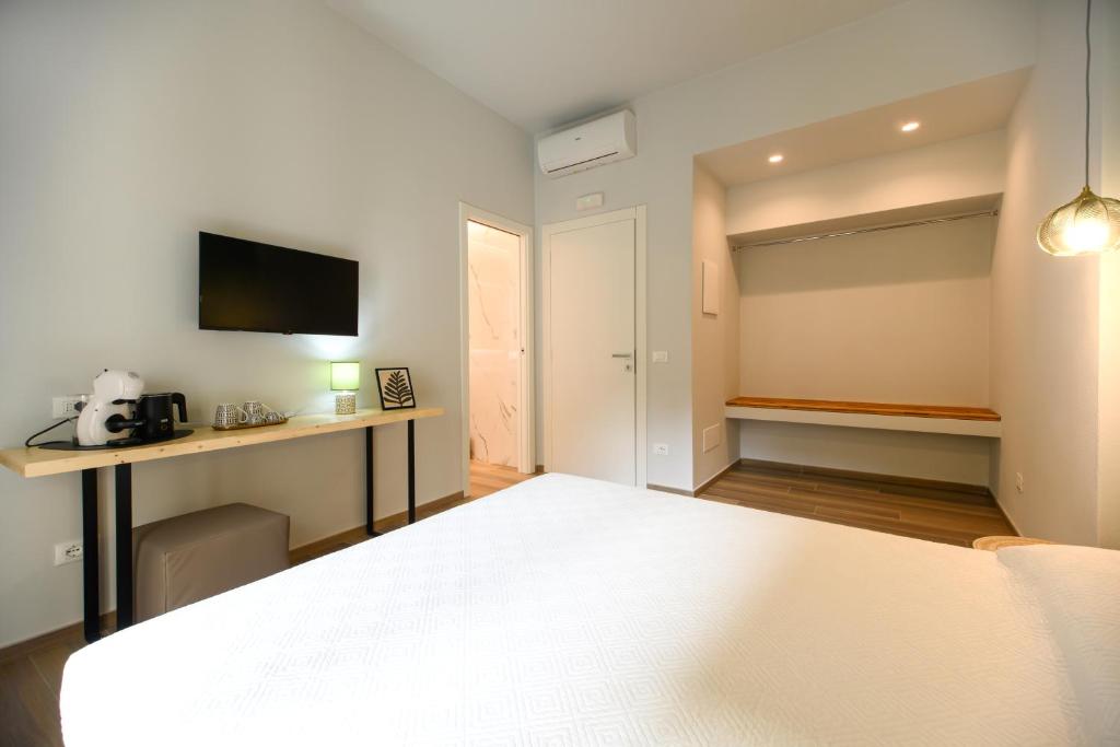 Postel nebo postele na pokoji v ubytování Bianca Elegance Rooms