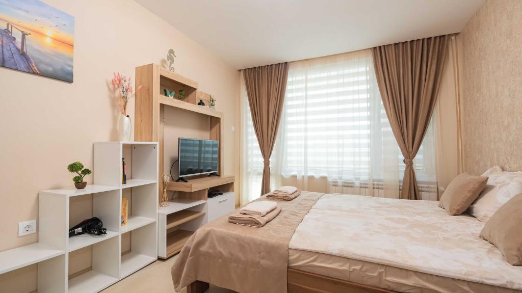 TV a/nebo společenská místnost v ubytování Lazur Delight