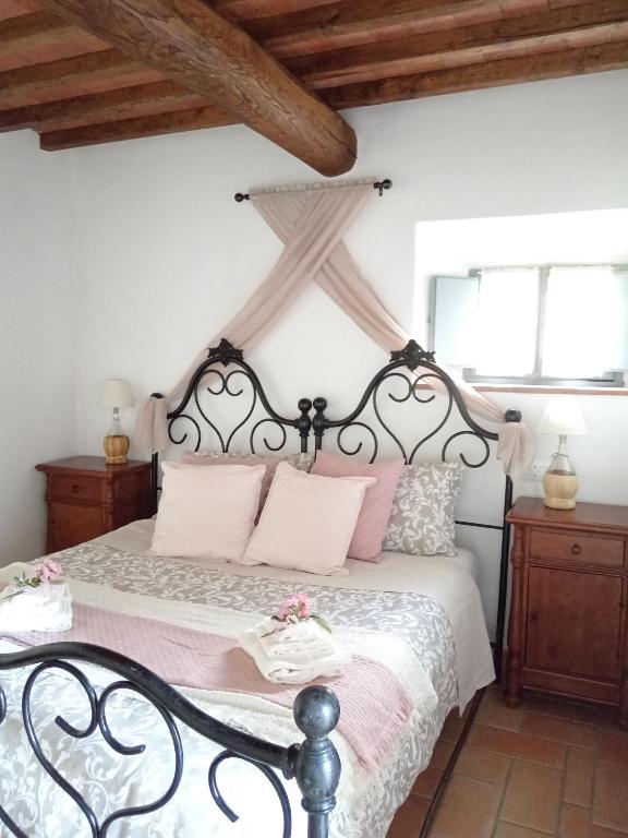 Postel nebo postele na pokoji v ubytování Casale - La Camera di Leda