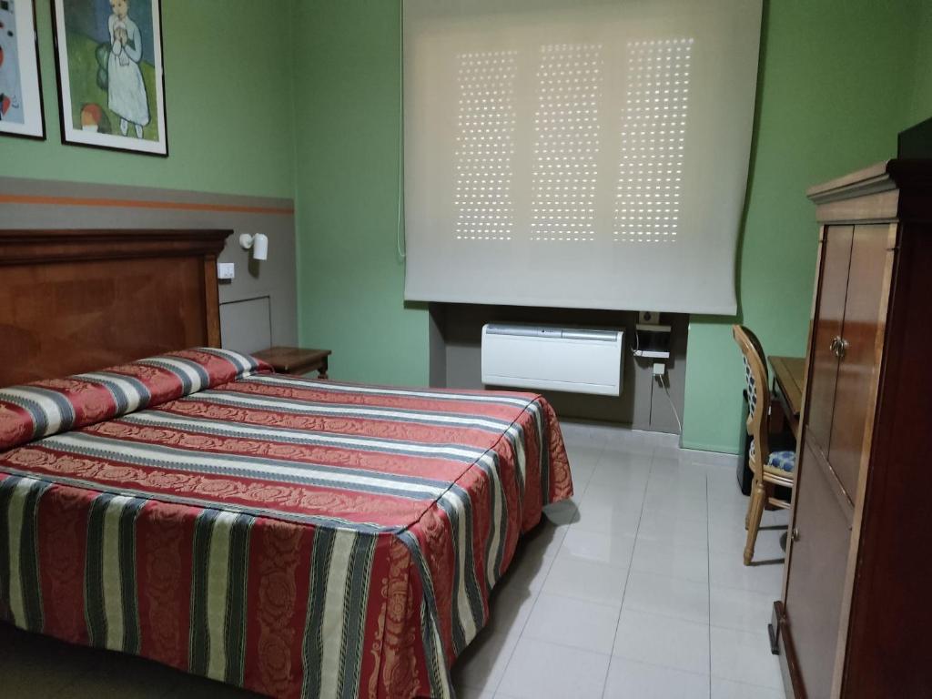 Postel nebo postele na pokoji v ubytování Hotel Plaza