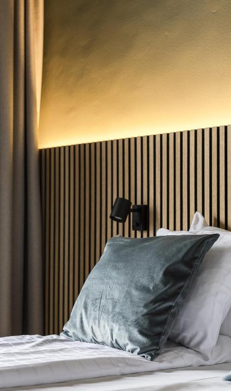Postel nebo postele na pokoji v ubytování Hotell Kramm