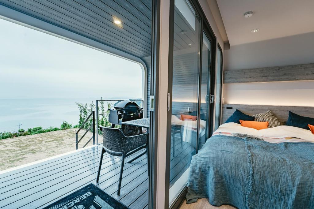 Postel nebo postele na pokoji v ubytování HARIO Beach Walk