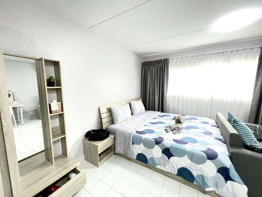 Postel nebo postele na pokoji v ubytování Impact C3 Muathong
