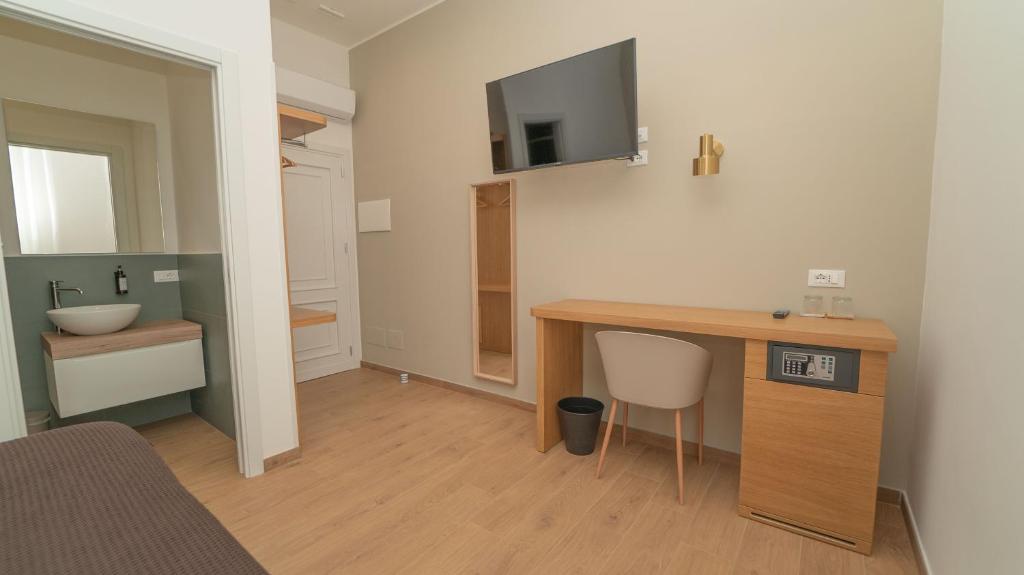 Postel nebo postele na pokoji v ubytování Manere Suites