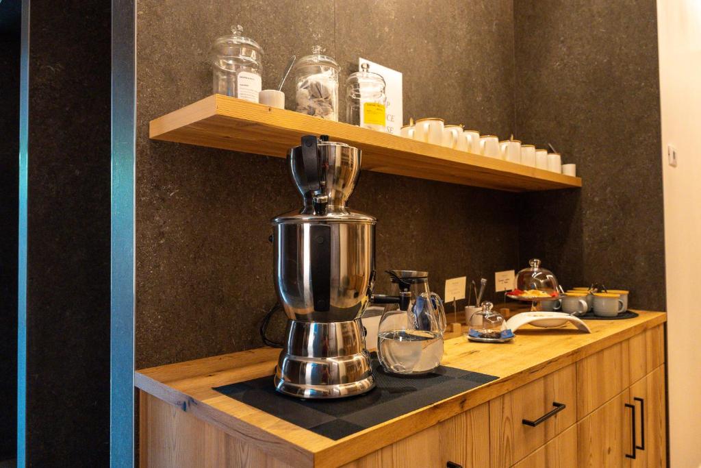 Příslušenství pro přípravu čaje a kávy v ubytování Aura Relais