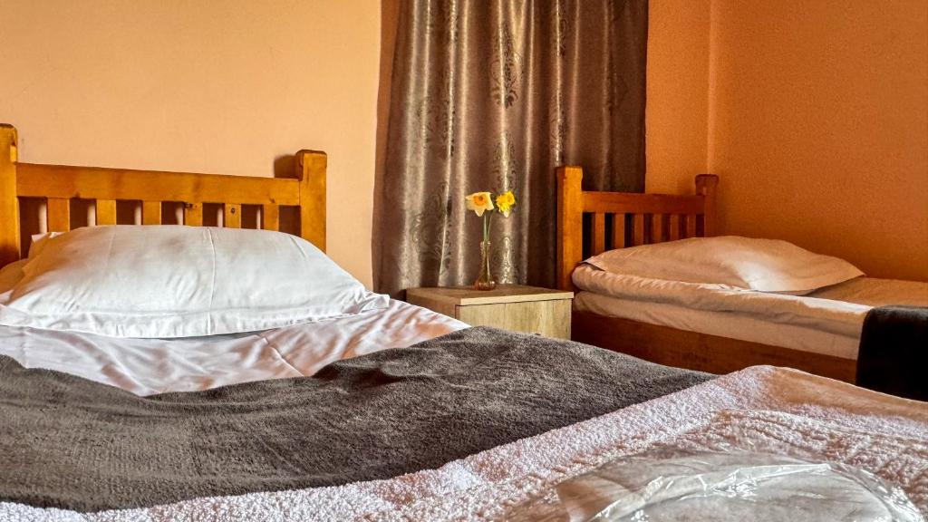 Postel nebo postele na pokoji v ubytování Cottage Gudauri