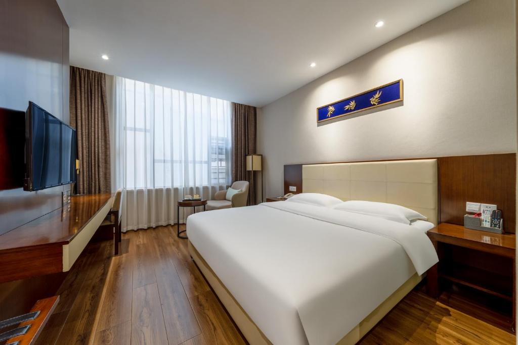 Postel nebo postele na pokoji v ubytování Milton Hotel