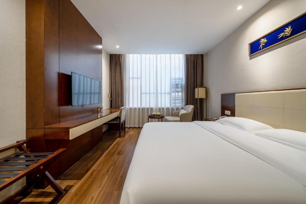 Postel nebo postele na pokoji v ubytování Milton Hotel