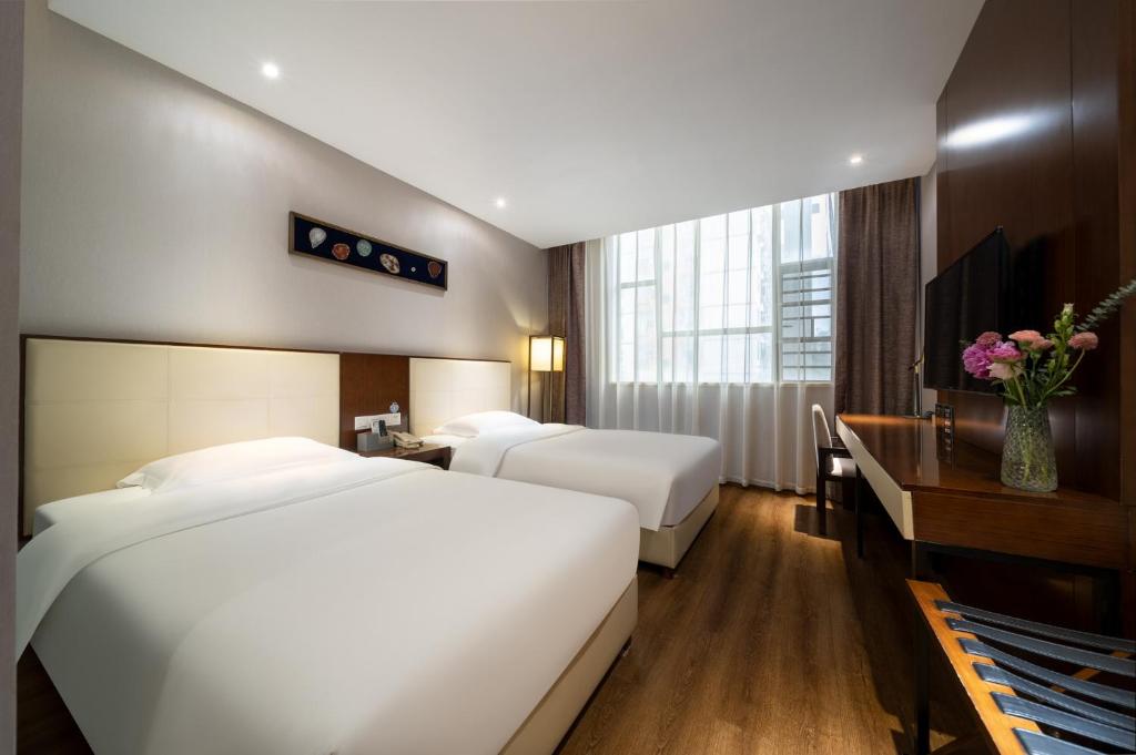 Postel nebo postele na pokoji v ubytování Milton Hotel