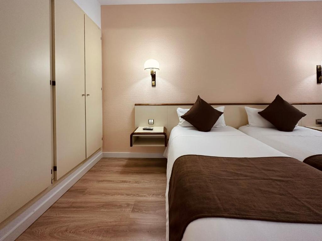 Postel nebo postele na pokoji v ubytování Andorra Palace
