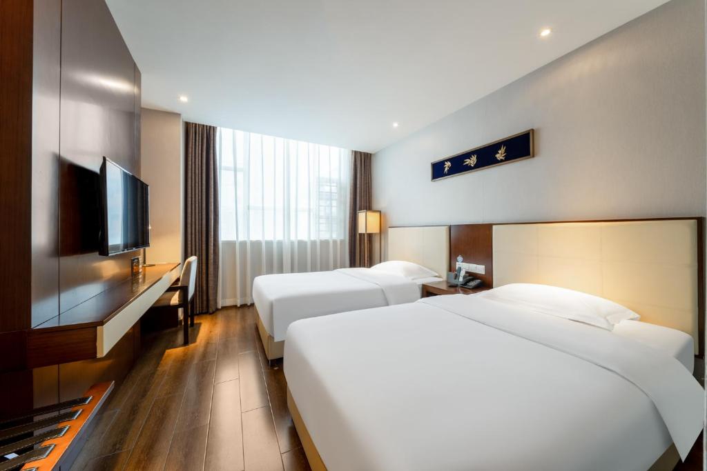 Postel nebo postele na pokoji v ubytování Milton Hotel