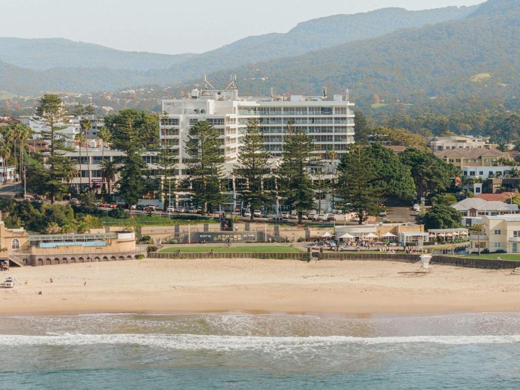 a view of a beach with a large building at Novotel Wollongong Northbeach in Wollongong