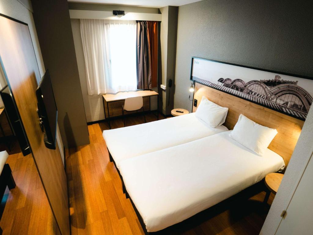 Postel nebo postele na pokoji v ubytování Ibis Valladolid