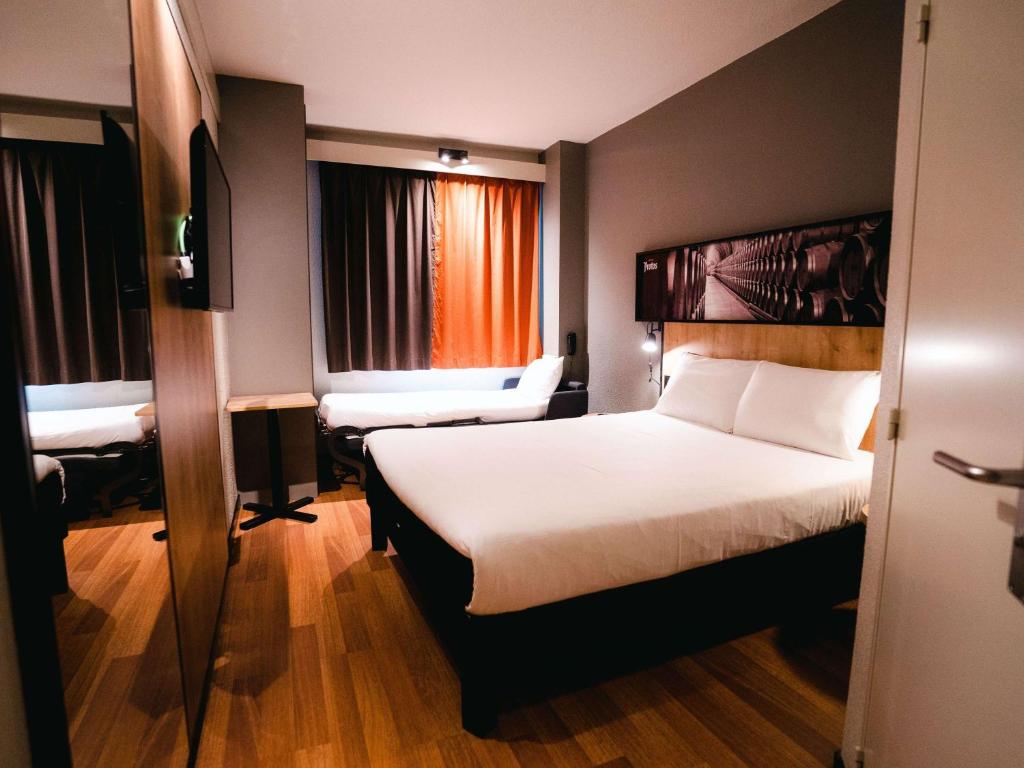 Postel nebo postele na pokoji v ubytování Ibis Valladolid
