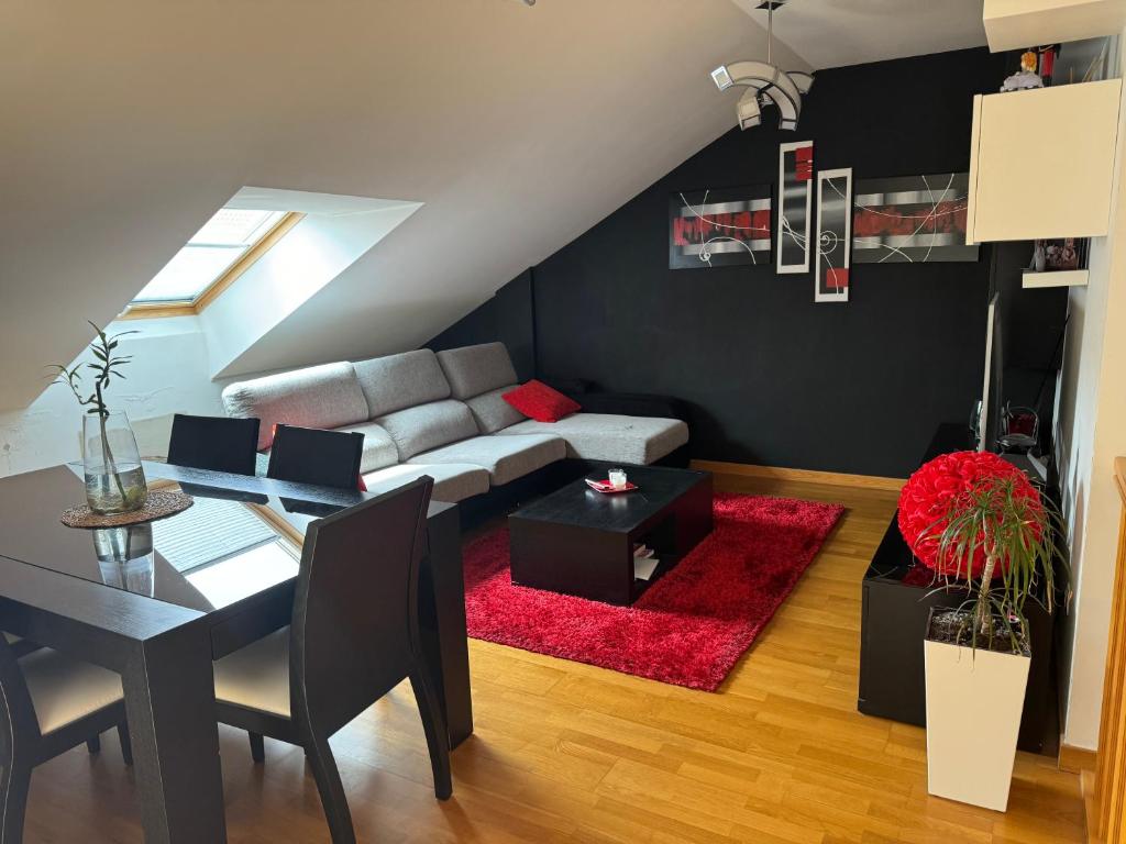 a living room with a couch and a table at Duplex Moaña Centro in Moaña