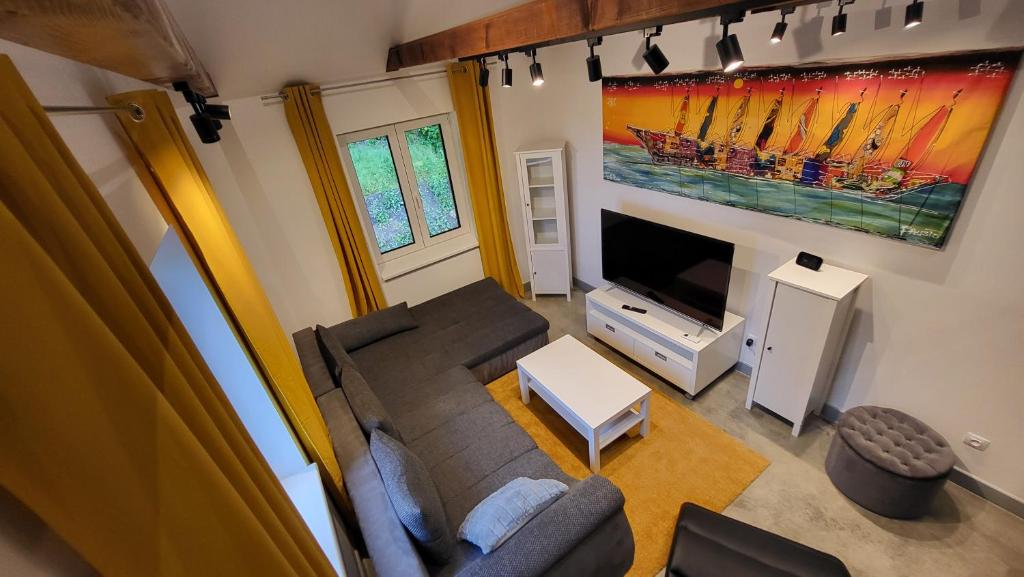 TV a/nebo společenská místnost v ubytování Apartmány pod Prašivou