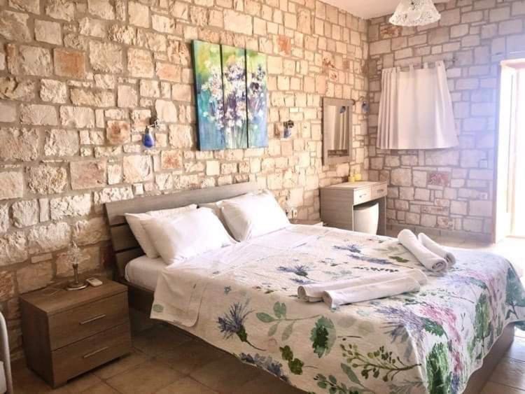 Postel nebo postele na pokoji v ubytování Deep Blue Villas