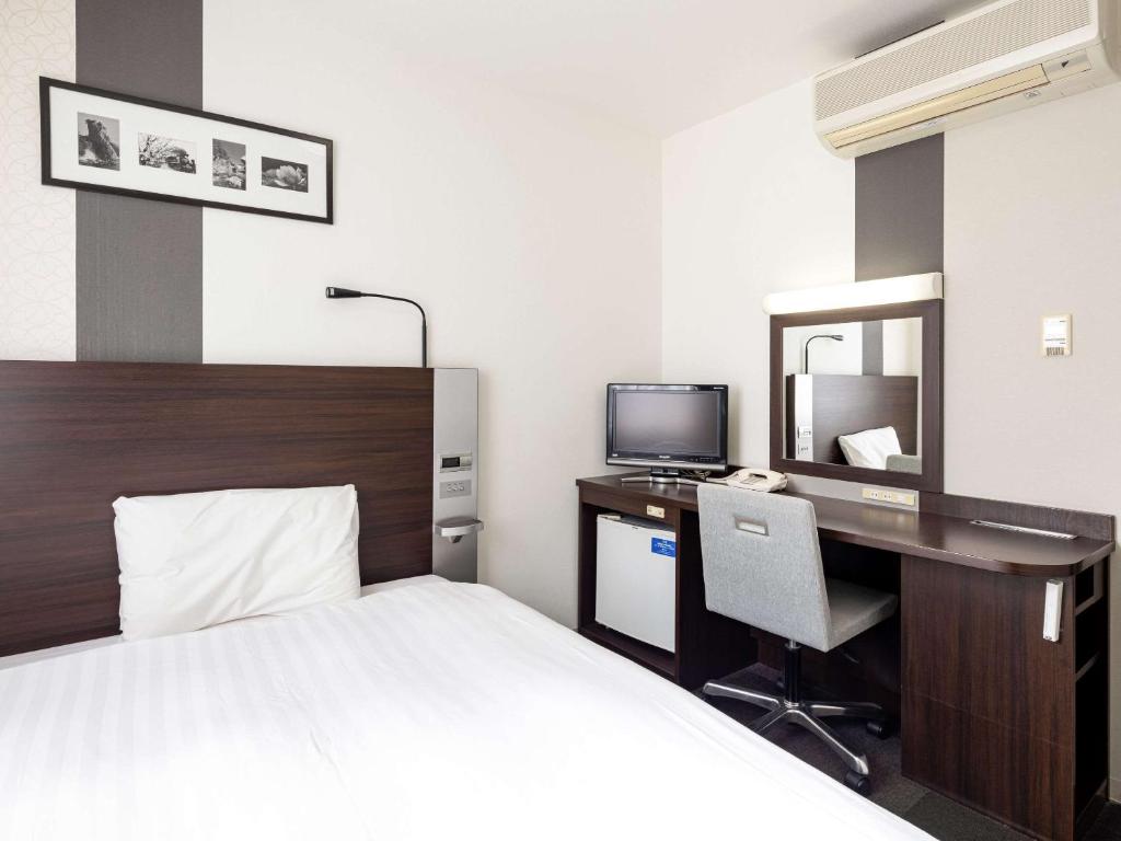 Postel nebo postele na pokoji v ubytování Comfort Hotel Shin Yamaguchi