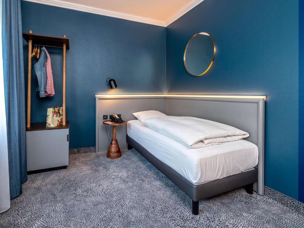 Postel nebo postele na pokoji v ubytování Mercure Hotel Luebeck City Center